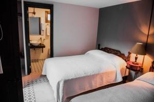 Postel nebo postele na pokoji v ubytování TIERRA SOÑADA HOTEL BOUTIQUE