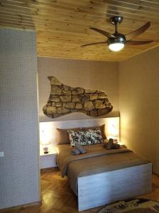 Postel nebo postele na pokoji v ubytování Guesthouse Litoros