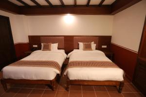 Letto o letti in una camera di Pahan Chhen - Boutique Hotel