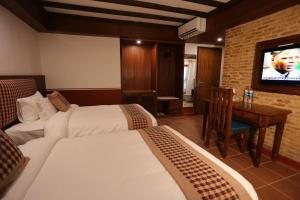 Letto o letti in una camera di Pahan Chhen - Boutique Hotel