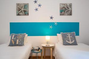 Postel nebo postele na pokoji v ubytování Stay U-nique Apartments Sicília