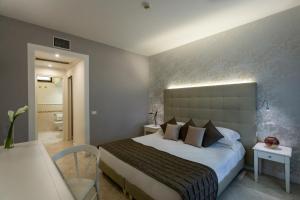 Ein Bett oder Betten in einem Zimmer der Unterkunft Hotel Airone isola d'Elba