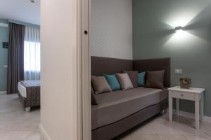 Ein Bett oder Betten in einem Zimmer der Unterkunft Hotel Airone isola d'Elba