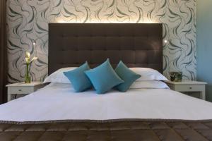 Ein Bett oder Betten in einem Zimmer der Unterkunft Hotel Airone isola d'Elba
