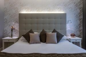 Ein Bett oder Betten in einem Zimmer der Unterkunft Hotel Airone isola d'Elba
