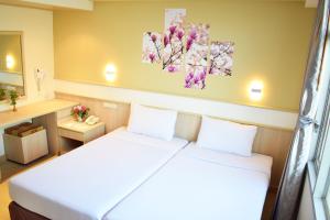 Postel nebo postele na pokoji v ubytování Trang Hotel Bangkok - SHA Plus