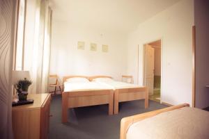 Posteľ alebo postele v izbe v ubytovaní Rooms Medved + 12 fotografií