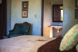 Postel nebo postele na pokoji v ubytování Kasbah Tabelkoukt