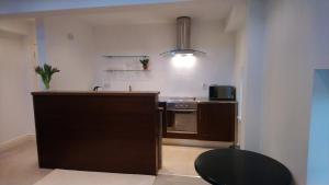 a kitchen with a sink and a counter top at 10 The Kiln in Westport