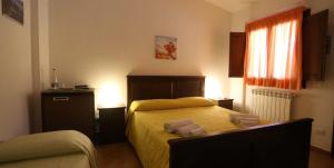 En eller flere senge i et værelse på Il Parco Di Nonna Betty