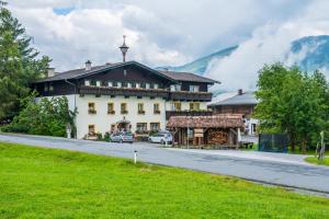 a large building on the side of a road at Salaterhof Embach in Lend