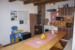 a kitchen with a wooden table with bananas on it at Holiday Homes 4N in Gornje Jesenje