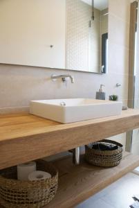 a bathroom counter with a sink and a mirror at La maison du Potier in Valras-Plage +52 photos