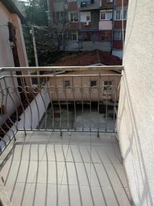 a balcony with a stair railing and a building at Cozy studio Belgrade (Zemun) in Belgrade