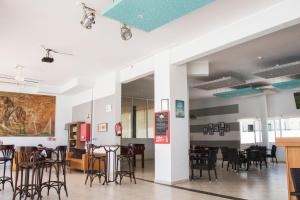 a dining area with tables and chairs in a restaurant at Apartamentos Lanzarote Paradise Colinas in Costa Teguise