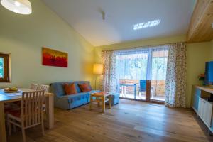 TV a/nebo společenská místnost v ubytování Haus Erika