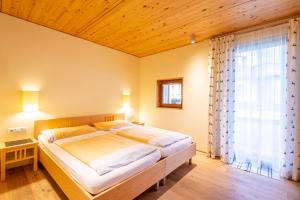 Postel nebo postele na pokoji v ubytování Haus Erika