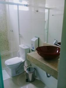 a bathroom with a sink and a toilet at O Neves Hotel in Guanambi