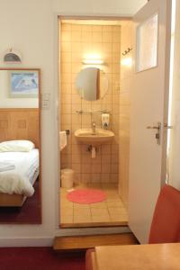 Ett badrum på Hotel 2000 Valkenburg