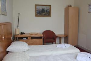 Postel nebo postele na pokoji v ubytování Hotel 2000 Valkenburg