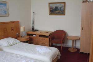 Postel nebo postele na pokoji v ubytování Hotel 2000 Valkenburg