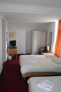 Postel nebo postele na pokoji v ubytování Hotel 2000 Valkenburg