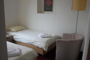 Postel nebo postele na pokoji v ubytování Hotel 2000 Valkenburg
