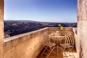 Palazzo Gattini Luxury Hotel tesisinde bir balkon veya teras