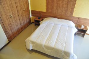 Cama ou camas em um quarto em Hotel da Montanha