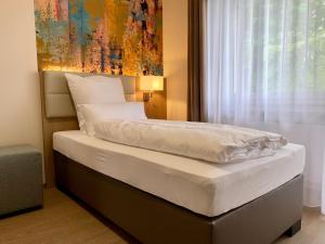 Postel nebo postele na pokoji v ubytování Thermalhotel Kemper + 37 fotografií