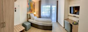 Ein Bett oder Betten in einem Zimmer der Unterkunft Thermalhotel Kemper
