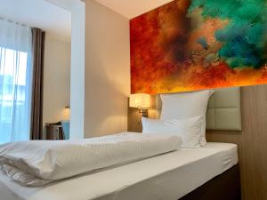 Ein Bett oder Betten in einem Zimmer der Unterkunft Thermalhotel Kemper