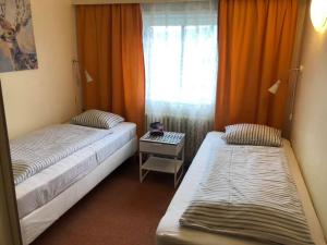 Posteľ alebo postele v izbe v ubytovaní Hotel Hromovka