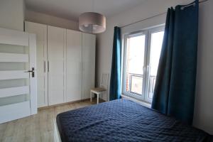 Posteľ alebo postele v izbe v ubytovaní Kościuszki 130 C TectumApartments