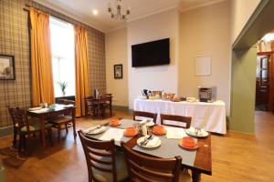 a dining room with a table and chairs at The Bridge Inn Hotel in Bolton