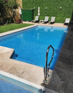 a large swimming pool with aicrobialicrobialicrobialicrobialicrobialicrobial at Hotel Crillon Mendoza in Mendoza