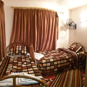 Кровать или кровати в номере The Orient Home