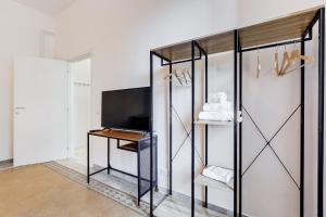 Televiisor ja/või meelelahutuskeskus majutusasutuses BDC - Termini Sun Apartment