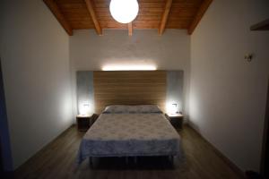 Кровать или кровати в номере Agriturismo al Riparo dai Venti