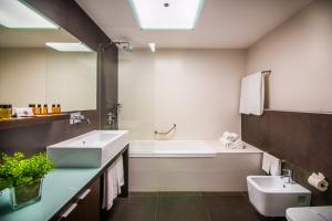 Um banheiro em RR Hotel da Rocha