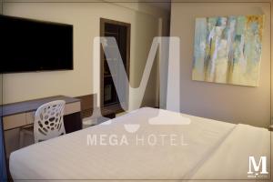 Postel nebo postele na pokoji v ubytování Hotel Mega + 22 fotografií