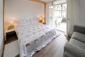 Ένα ή περισσότερα κρεβάτια σε δωμάτιο στο Hotel Bellevue