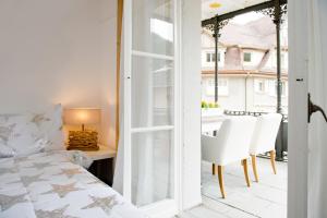 Ένα ή περισσότερα κρεβάτια σε δωμάτιο στο Hotel Bellevue