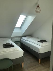 Postel nebo postele na pokoji v ubytování Sissi Apartments