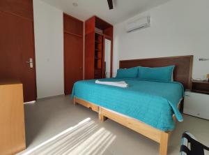 Postel nebo postele na pokoji v ubytování Kai Hotel