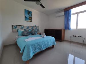 Postel nebo postele na pokoji v ubytování Kai Hotel