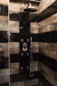 a bathroom with a shower with a glass door at Casa Georgina in Thessaloniki +14 photos