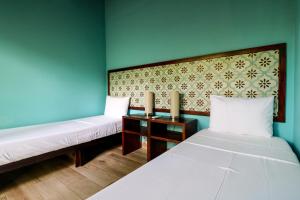 Postel nebo postele na pokoji v ubytování Teva Hotel & Jungle Reserve