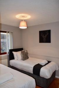 Postel nebo postele na pokoji v ubytování Kelpies Serviced Apartments Hamilton- 2 Bedrooms