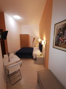 Postel nebo postele na pokoji v ubytování Borgo Marinaro